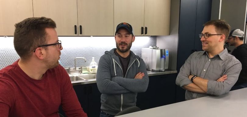 PerkSpot team chatting in the kitchen