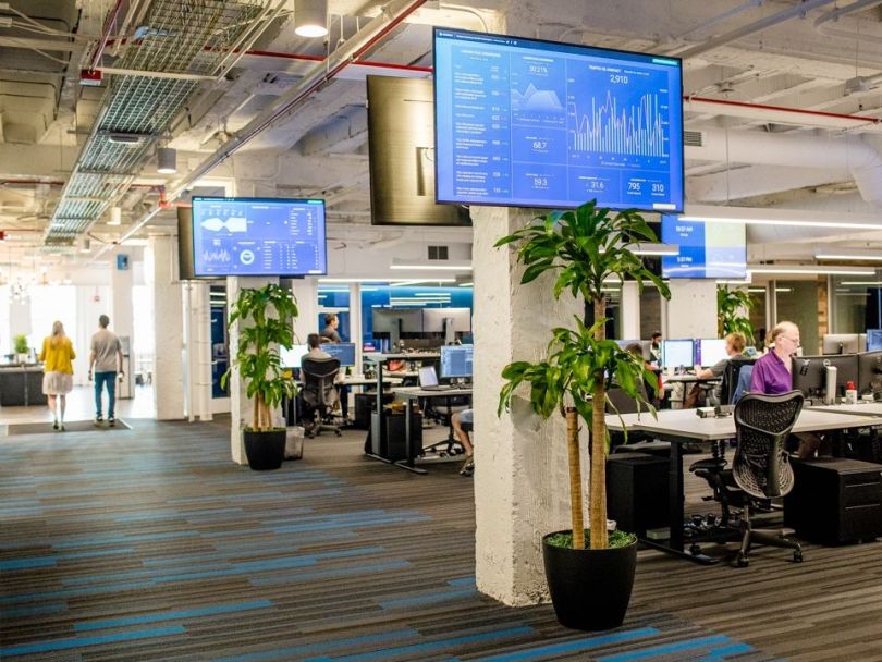 project44 office with large monitors on the wall and team members working at desks