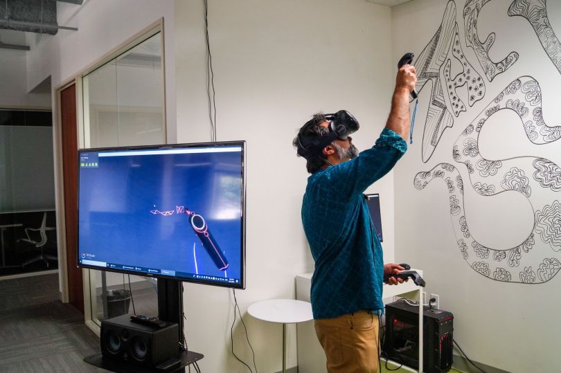 man using virtual reality headset 