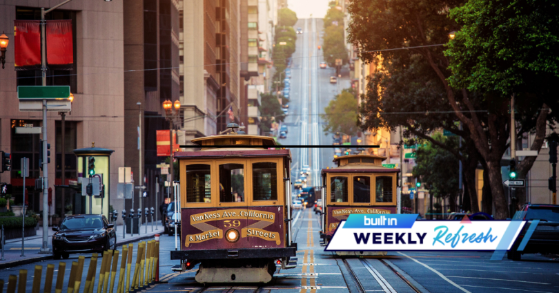 A San Francisco cable car going up a hill.