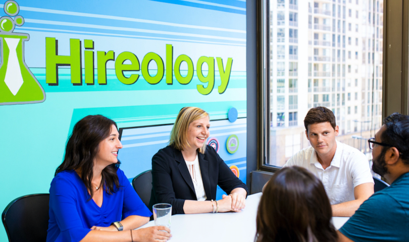 Hireology staff around a table chatting