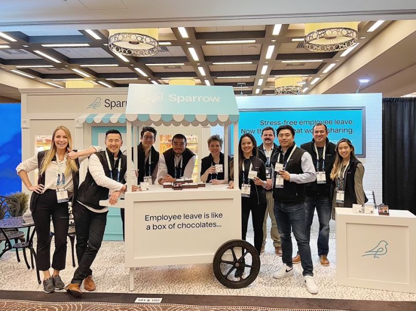 Sparrow team members standing with a dessert cart