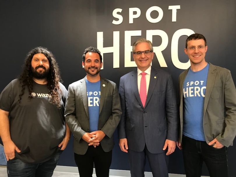 Leaders posing at a SpotHero press event