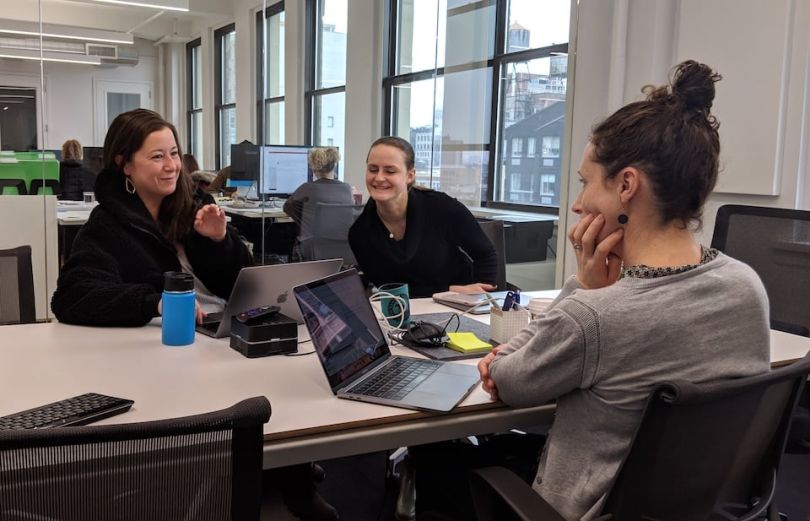 Spruce team members working in conference room
