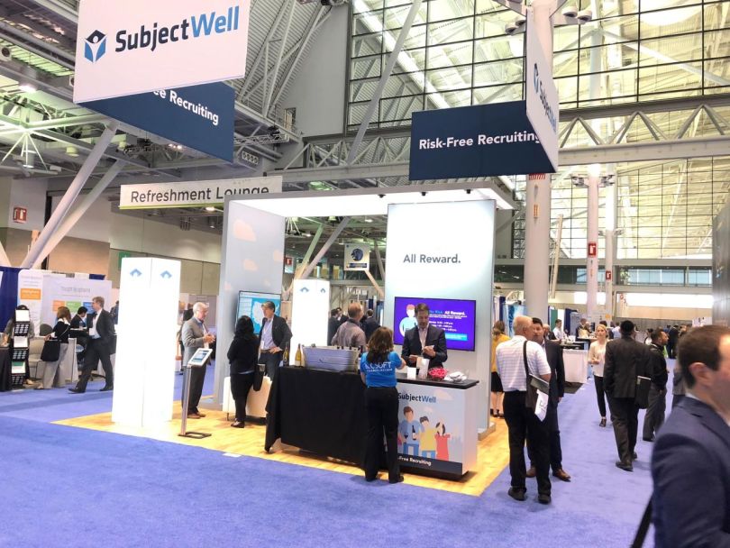 SubjectWell’s booth at an indoor convention