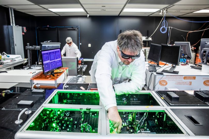 Bjorn Manuel Hegelich aligns laser beams at the University of Texas at Austin