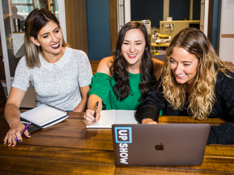 Angie Senkpeil shares a joke with coworkers