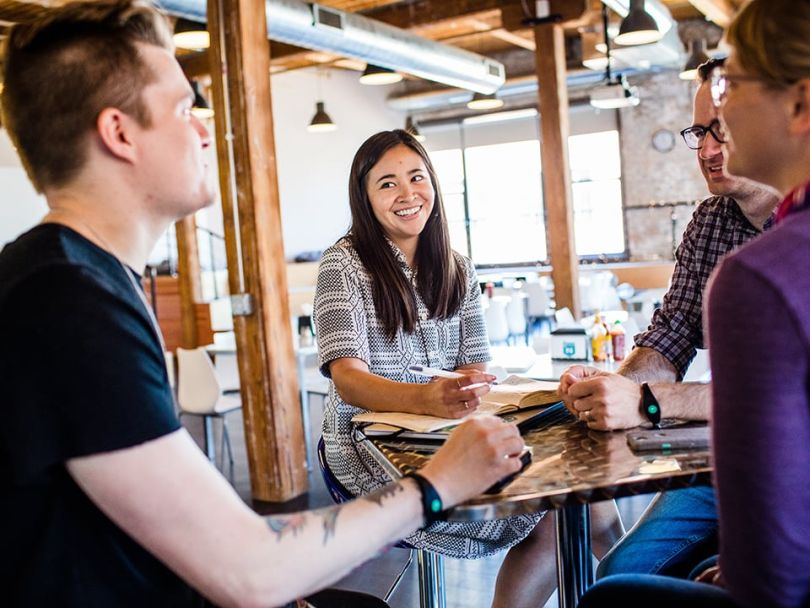 Natalie Yee laughs with coworkers