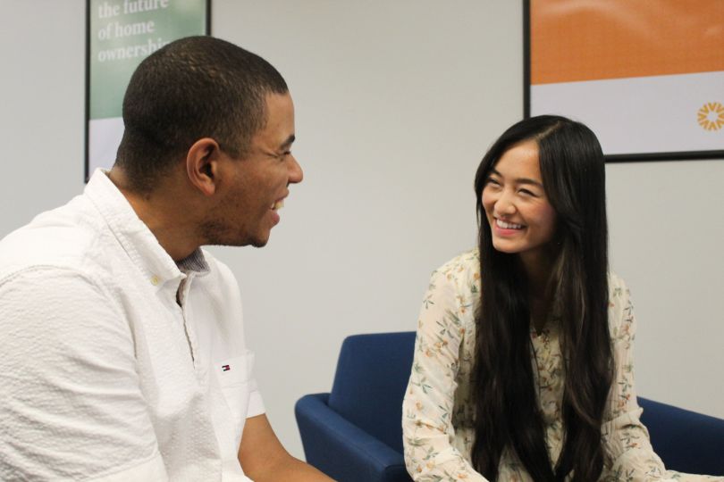 Valon team members have a cheerful conversation.