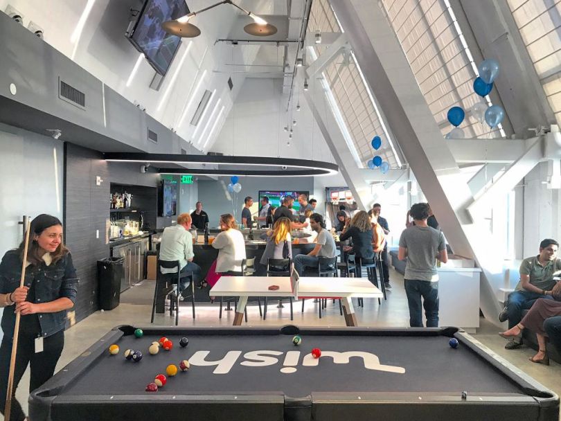 Team members in the Wish office