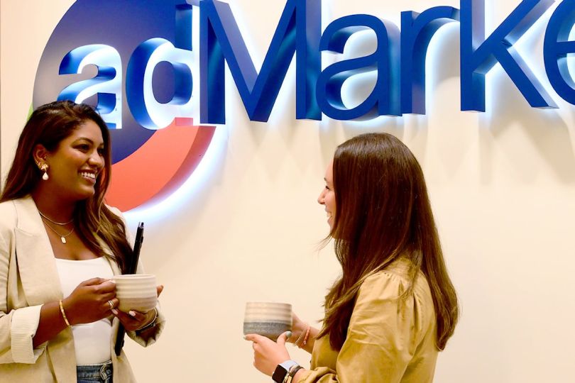 adMarketplace team members having a conversation in the office