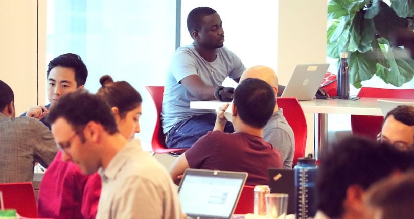 bswift team members working and chatting