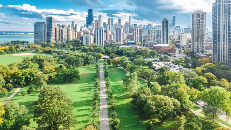 An overhead view of a park and the Chicago skyline.