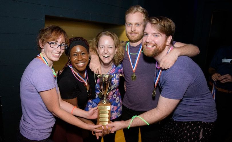 cleverbridge team posing with trophy