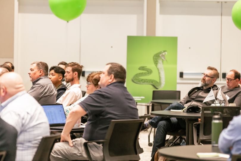 Nasuni team members listen to a presentation.