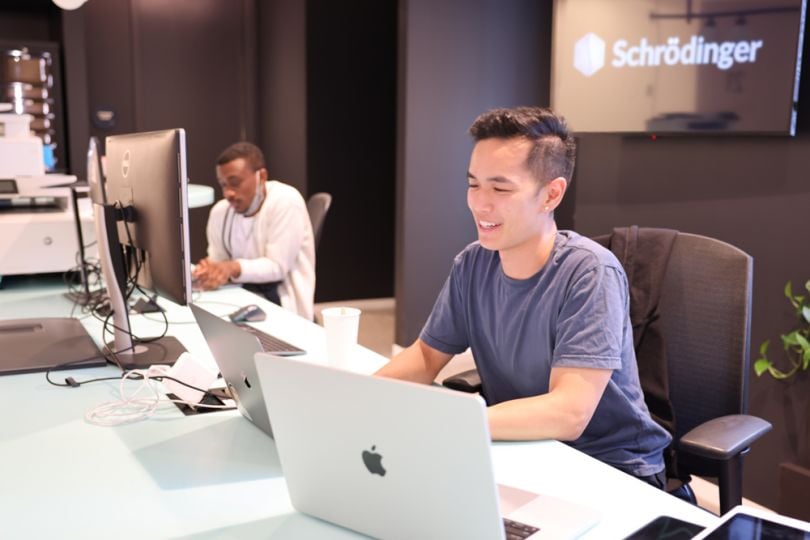 photo of employees working a shared workspace