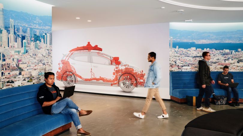 Cruise office lobby with workers sitting, moving about