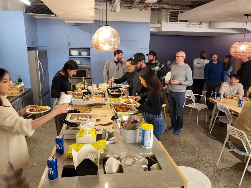 Roofr employees dining together in their offices