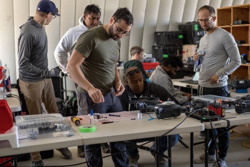 Technicians and engineers work together on hardware