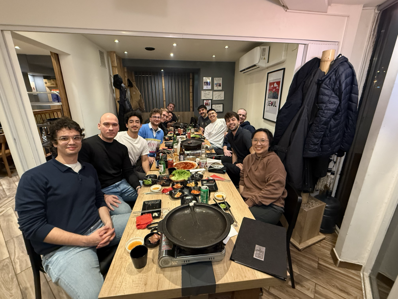 ARB Interactive team members pose for a photo while having dinner together at a restaurant&nbsp;