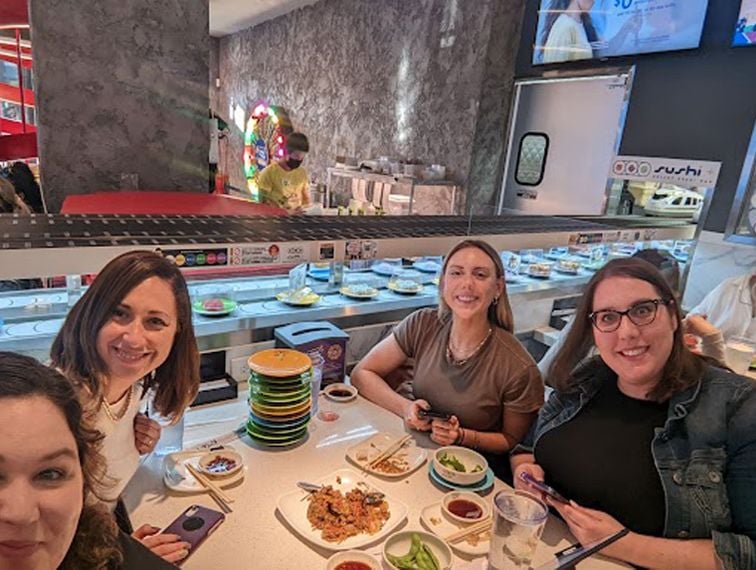 Adtaxt team members at a sushi restaurant together