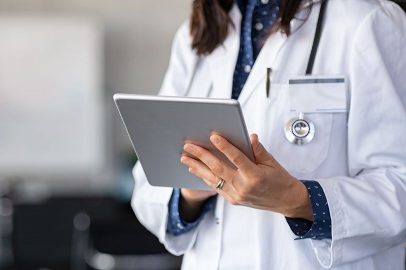 Doctor using a digital tablet