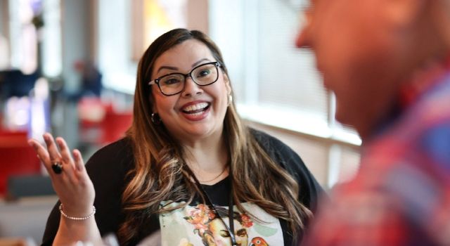 Candid photo of woman talking and smiling