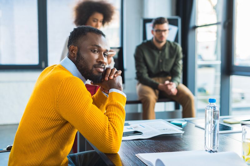 Babylon team member sitting at a conference table