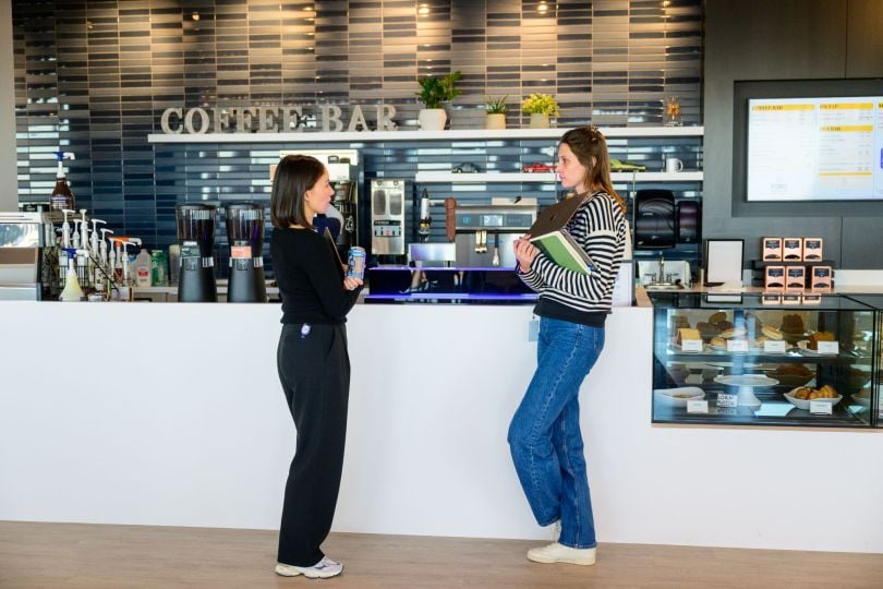 Two CarGurus team members stand at the coffee bar inside the company’s new global headquarters at 1001 Boylston Street in Boston’s Back Bay neighborhood.