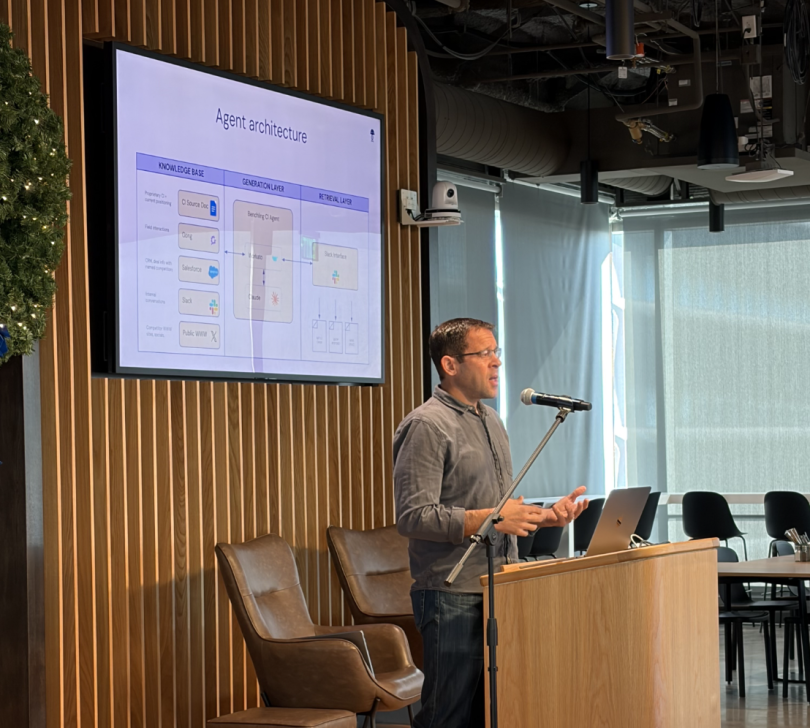 A Benchling team member presents onstage during AI Week