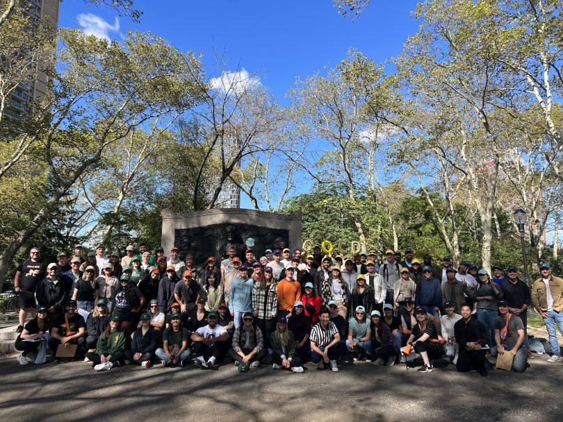 Block Renovation team photo taken outside with clear blue sky and trees