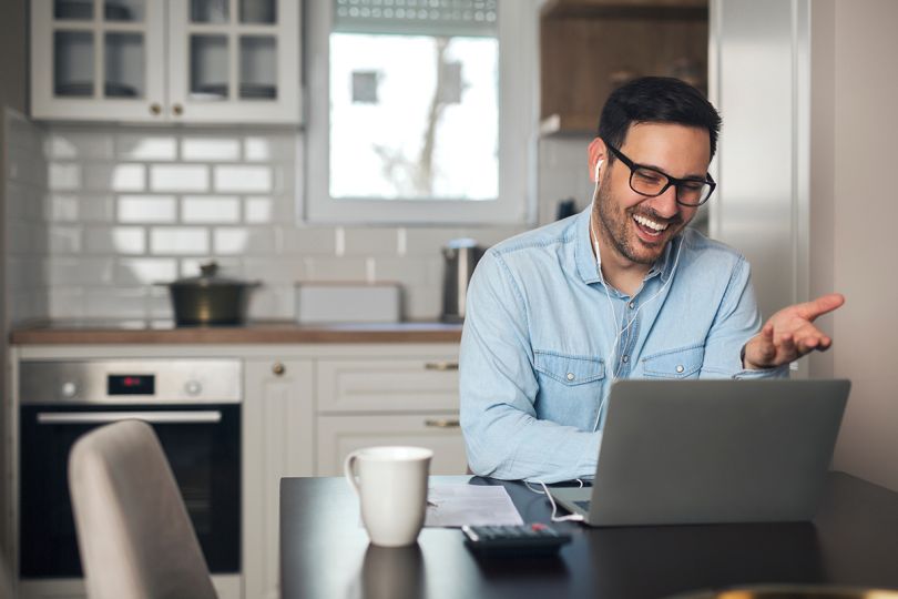 man on a work video call from home