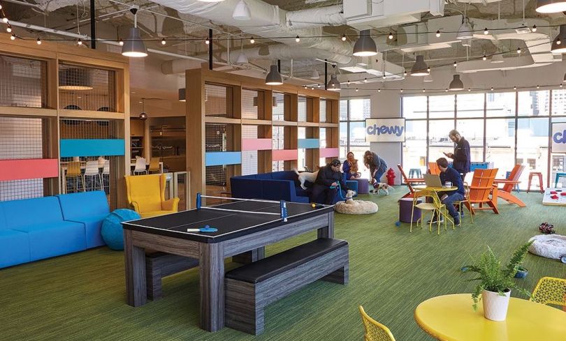 Chewy office leisure space with ping pong table and colorful tables and chairs