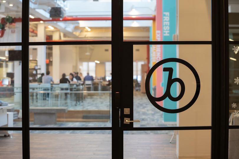 Braze logo on a glass door in the office