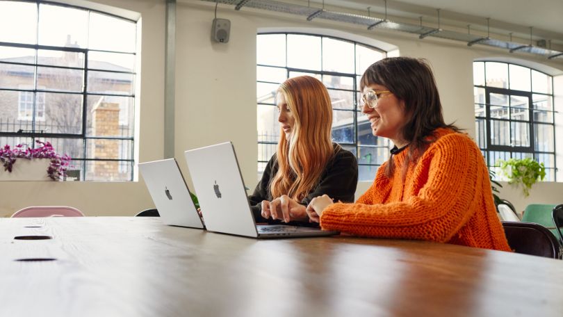 Two ladies working on a laptop