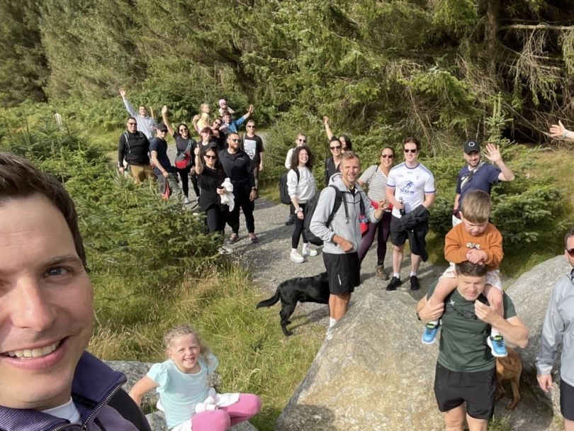 The CarGurus team smiles and celebrates on a group hiking excursion.