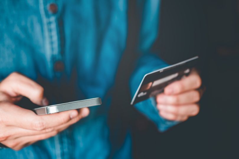 Person making an online purchase on a smartphone