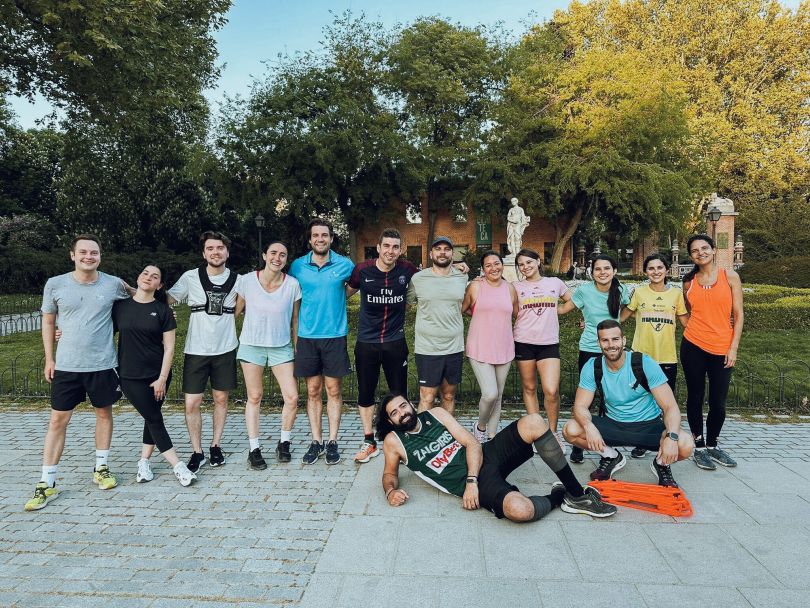 A group of Celonis team members take a photo before running a race.