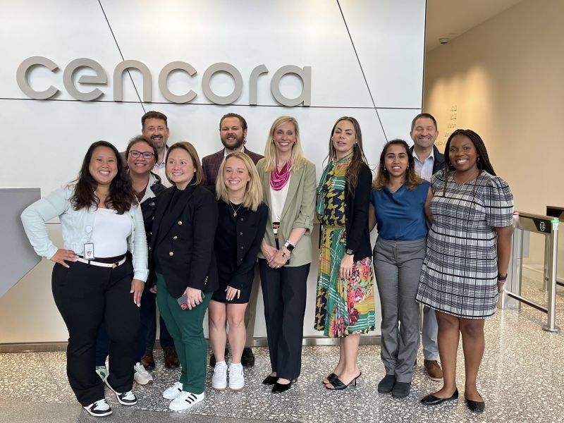 The Cencora team poses for a group photo in the reception area of one of their offices.