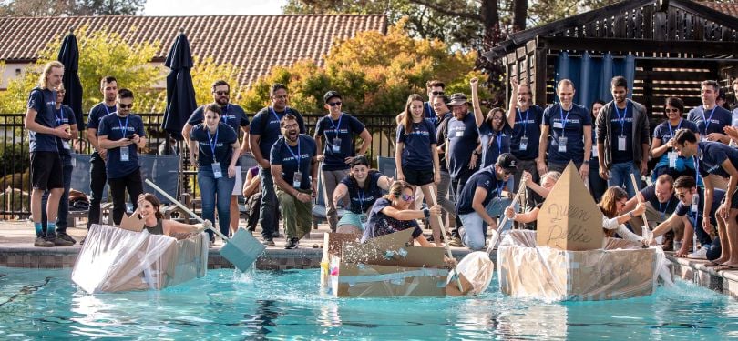 Coalition employees stand by a pool