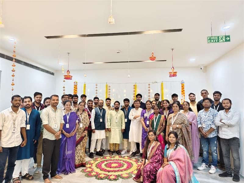 Team members pose for a group photo in the company’s India office