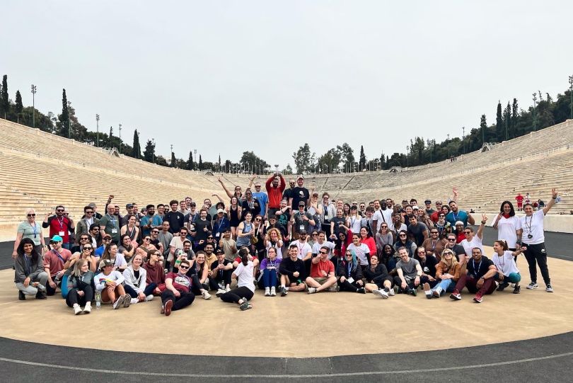 A medium-sized group of employees from Cutomer.io pose in an amphitheater