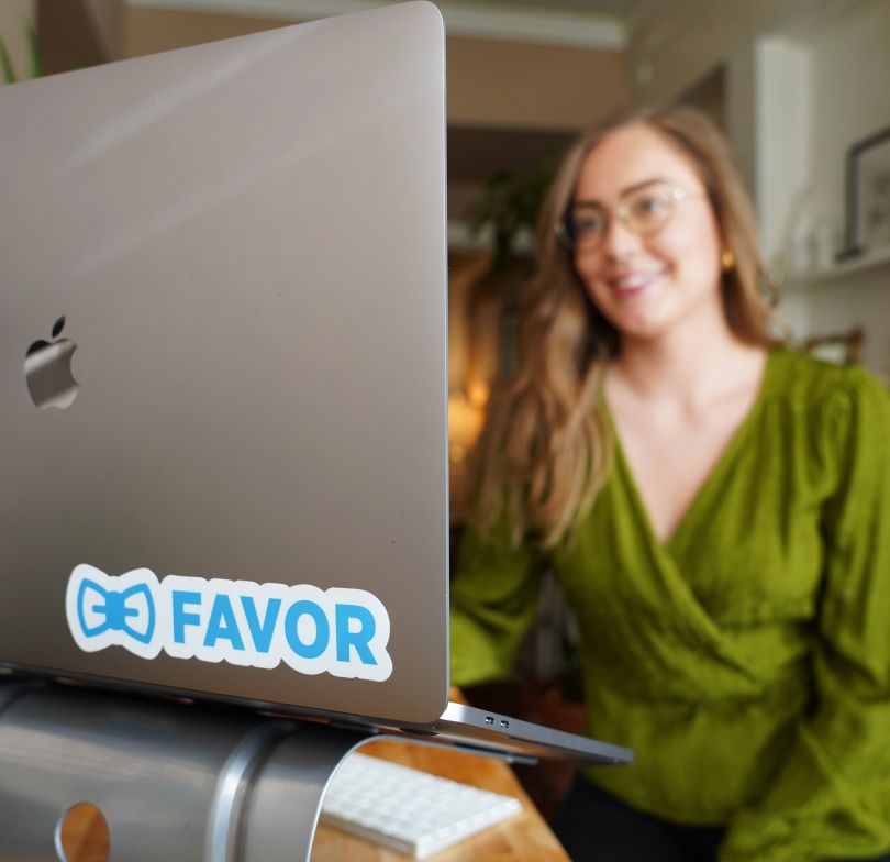 Favor team member working on her desktop computer