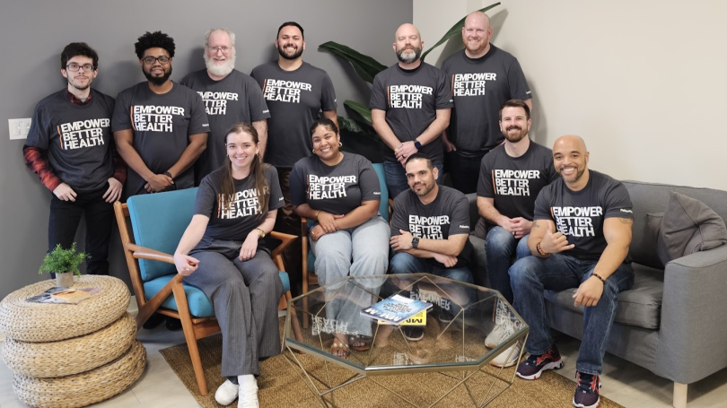 Group photo of PatientPoint team members wearing shirts that read "Empower Better Health."