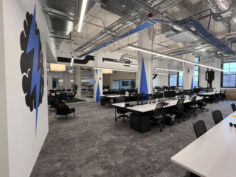 Energy CX office area with rows of desks and chairs