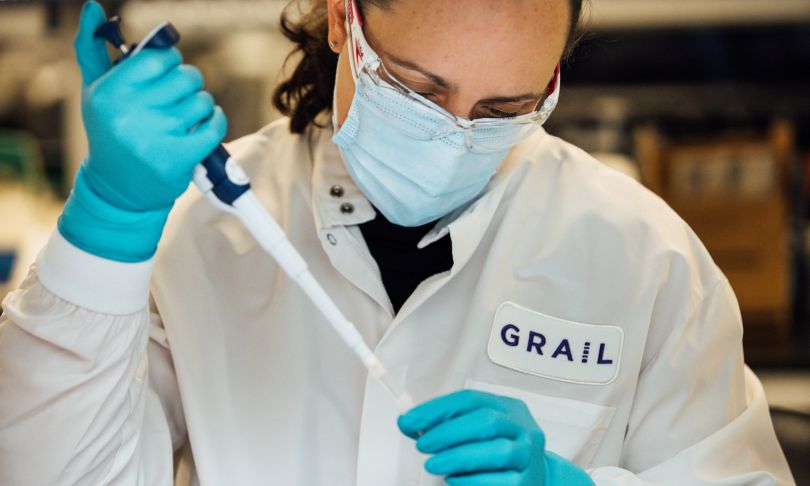 Photo of a GRAIL scientist working with a sample tube.