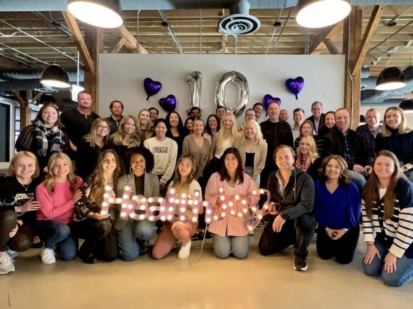 The HealthJoy team poses for a celebratory group photo on the company’s tenth anniversary.