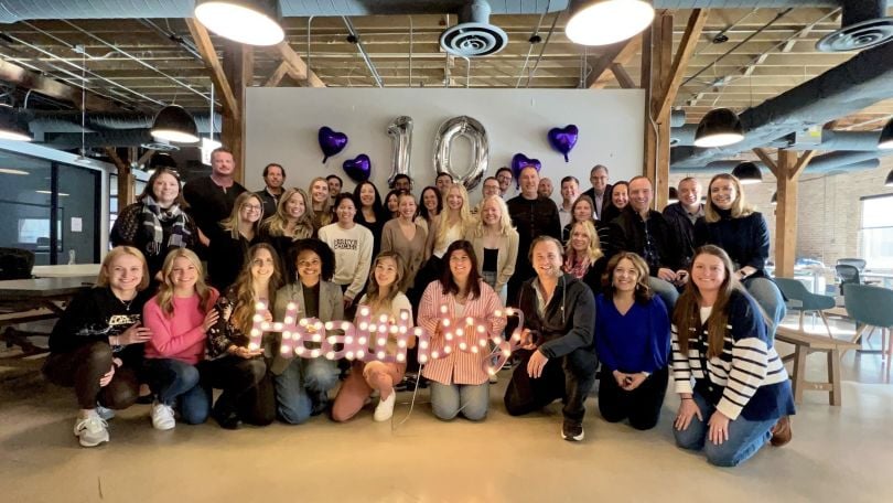 HealthJoy team posing for a photo at a company celebration.  