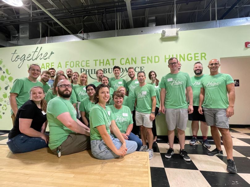 HealthVerity employees wear green shirts at a volunteering event