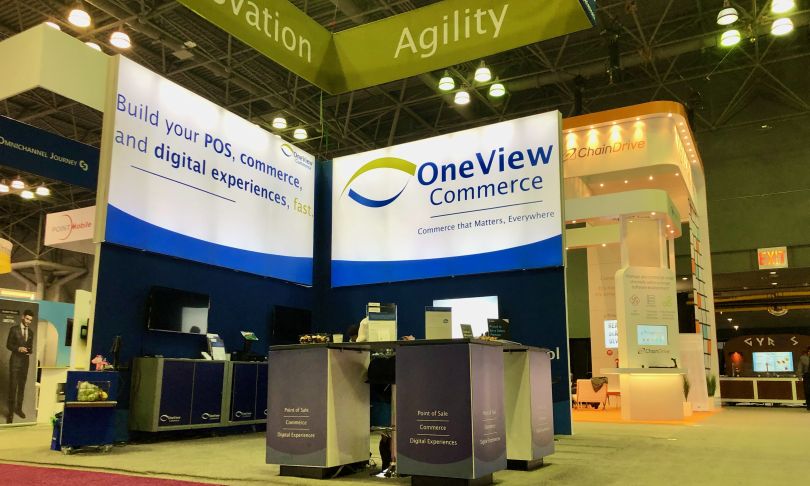 Photo of the OneView Commerce booth at a trade expo.